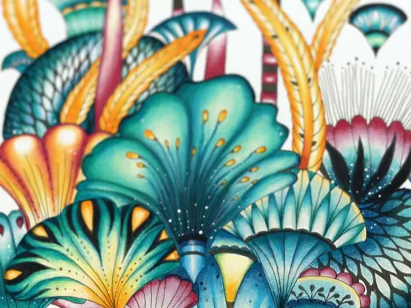 A page of teal, gold and pink fantasy flowers colored in pencil