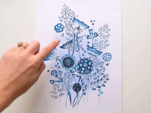A blue floral drawing with a soft aura around it
