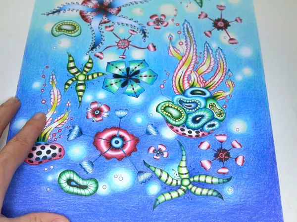 A page of sea creatures over a blue gradient background