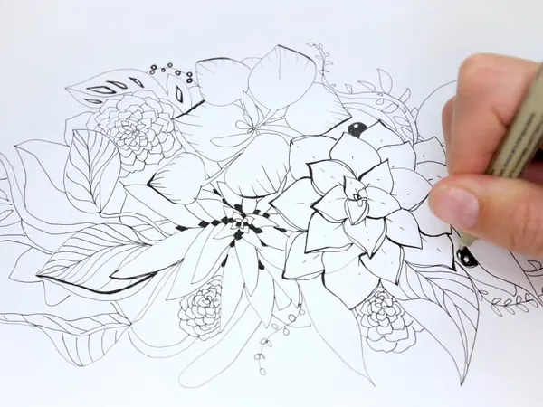 A floral composition being drawn in pen
